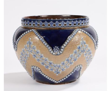 Royal Doulton jardiniere, with pierced rim, the blue and light brown ground with raised beaded, acanthus leaf and scroll deco