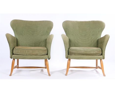 Two Ercol light wood easy chairs, the green upholstery with white dash decoration, button backs, on out-splayed turned legs a