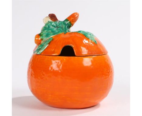 Clarice Cliff Bizarre preserve pot, in the form of an orange, with a leaf handle above the orange body, 10cm high