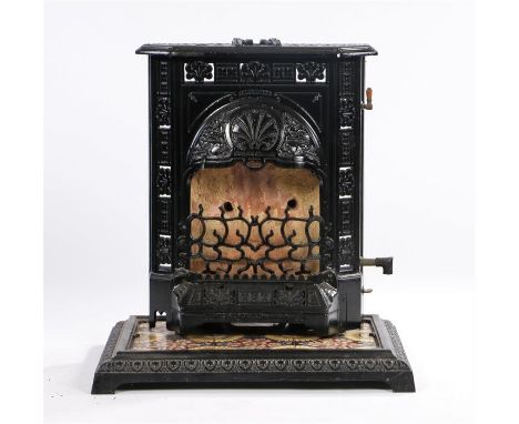 Richmonds Limited Warrington Stratford gas stove, the cast iron body with hob to the top above a fire grate, on a tiled plint