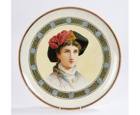 Arts and Crafts period Wedgwood earthenware charger, hand painted by Louis John Rhead (1858-1926) with a depiction of a young