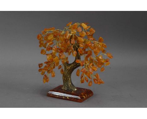A Rdzeniewski decorated tree sculpture, amber leaves, metal trunk with heightened gilt work on a resin rectangular base, 19cm