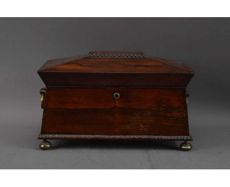 A 19th century Rosewood sarcophagus twin handled tea caddy, brass and wooden handles, the fitted interior converted to one co