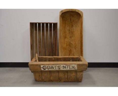 An early 20th century wooden trough, marked goats milk, evidence of woodworm and further wear/damage, AF, 28cm H x 76cm W, to