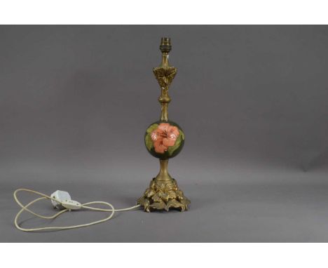 A 20th century Moorcroft pottery lamp, floral design the rest of the lamp gilt painted, will require re-wiring, 46.5cm high