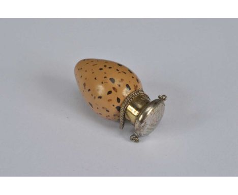 A small Victorian novelty porcelain and silver topped scent bottle, in the form of an egg, the underside of the body stamped 