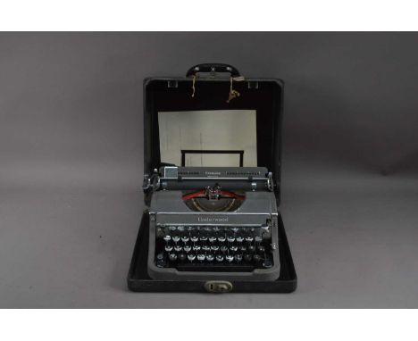 An Underwood Champion typewriter, untested in a fitted box, AF