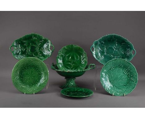 A collection of 19th century green majolica ceramic tableware's, comprising a compart (damaged), 17.5cm high, two oval twin h