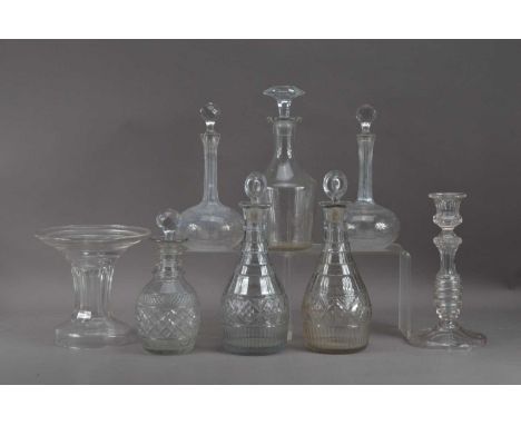 A collection of glass decanters, including two pairs, one pair lead, 30cm high, a glass candlestick, 25cm and a plate stand (