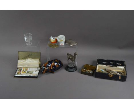 A mixed collection of works of art, comprising a damaged Mary Parr ceramic piggy bank, 17cm in length, a white metal Llama mo