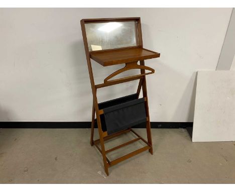 A c1970s Danish teak folding dressing stand, with mirror to upper and hinged shelf with clothes hanger, the rear lack two han