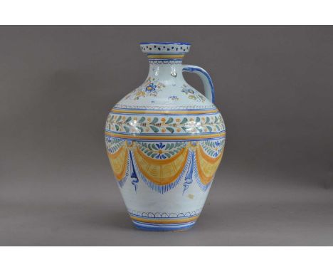 A 20th century large Talavera ceramic vessel, with a handle, painted design, the baluster body with multi-coloured swag decor