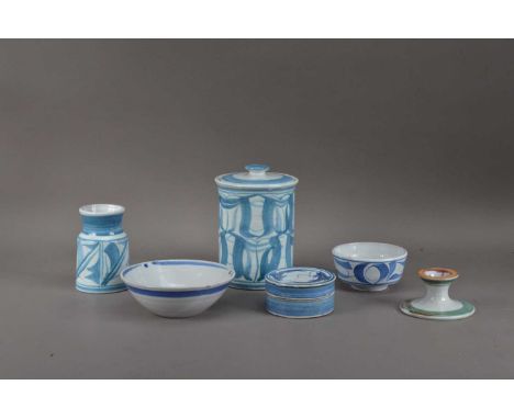 A collection of Aldermaston pottery items, all tin-glazed earthenware, comprising a jar and cover 16cm high, a smaller vessel