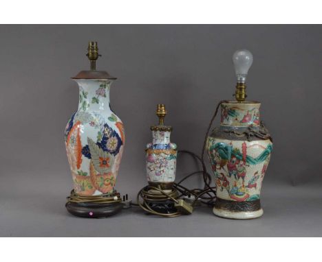 Three Chinese ceramic vases, converted to lamps, all with different patterns and sizes, in damaged condition, the largest, 49