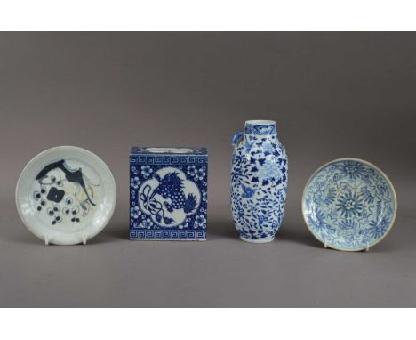 Four pieces of Chinese blue and white porcelain, comprising a handled vase, with foliate scroll decoration, the rim chipped a