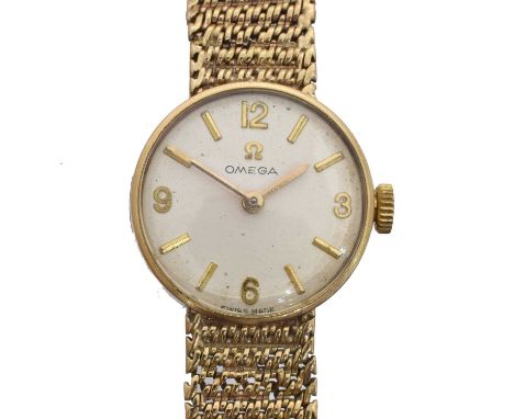 A 1960s 9ct gold Omega manual wind wristwatch, ref. 711.5500. The signed dial with baton and arabic markers, signed cal. 620 