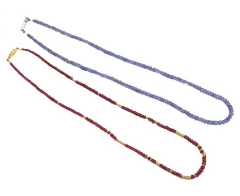 Two gem-set bead necklaces. To include a tanzanite necklace with 18ct gold push piece clasp, and a ruby bead necklace with 9c