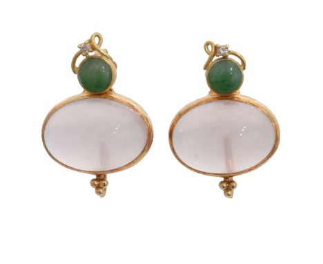 A pair of jade earrings. Each designed as a jade stud with colourless paste accent, stamped 18K, together with detachable moo