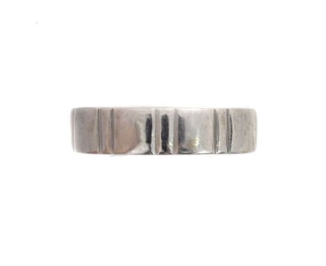An 18ct gold band ring. Of grooved design, sponsor's marks D&amp;Co, hallmarks for Birmingham, ring size P, gross weight 5.2g