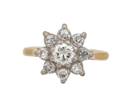 A diamond cluster ring by Boodle & Dunthorne. The brilliant cut diamond weighing approx. 0.40ct, estimated colour I-J, estima
