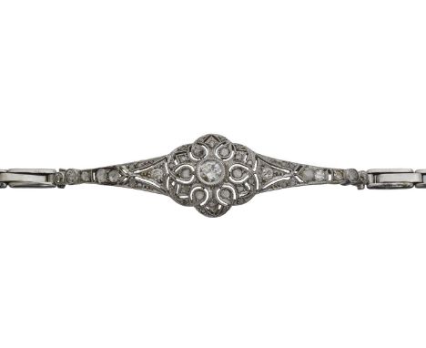 A diamond bracelet. The brilliant cut diamond within a vari-cut diamond openwork surround, and later extending link sides, cl