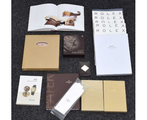 A collection of watch books and publications.  To include Patek Philippe (many with original cellophane in place) Rolex, etc 