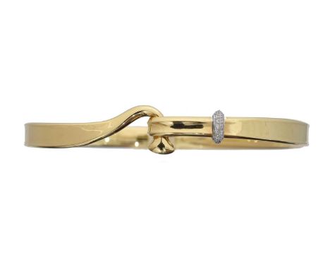 An 18ct gold diamond 'Torun' bangle by Georg Jensen. The polished bangle with hook fastening and brilliant cut diamond detail