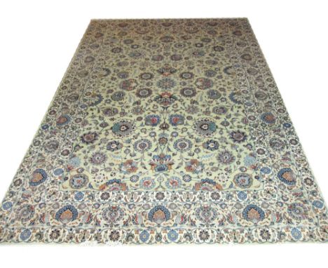 FINE SIGNED KASHAN CARPET, 395cm x 270cm, all over design of palmettes and vines on a jade field inside repeat palmette guard