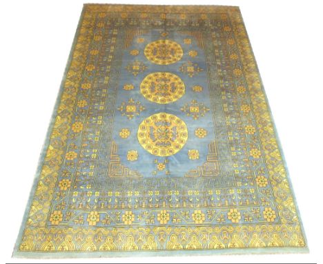 FINE SAMARKAND CARPET, 300cm x 197cm, triple medallions on a sky blue field of stylised flowerheads, within multiple correspo