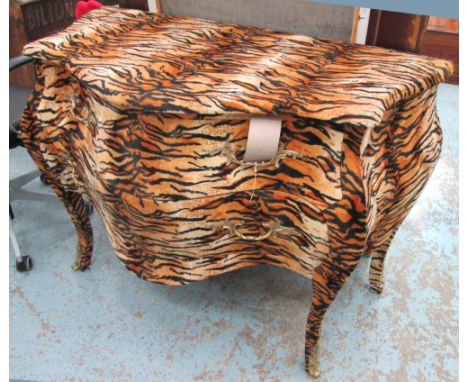 BOMBE COMMODE, in faux tiger skin, with two drawers below, on sabre supports, 123cm x 58cm x 87cm H.