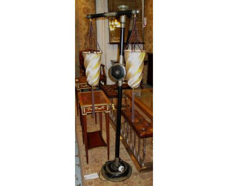 FORTUNY STANDING LAMP, Venetian ebonised in the Oriental taste with metal mounts and twin tassel decorated fabric shades, 50c