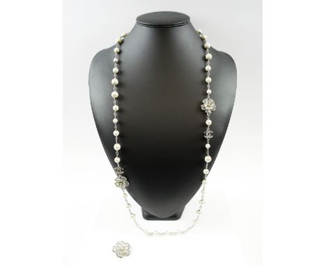 CHANEL CC PEARL NECKLACE AND CAMELLIA BROOCH faux pearls adorned with Swarovski crystals, signed Chanel 13A L.117cm.
