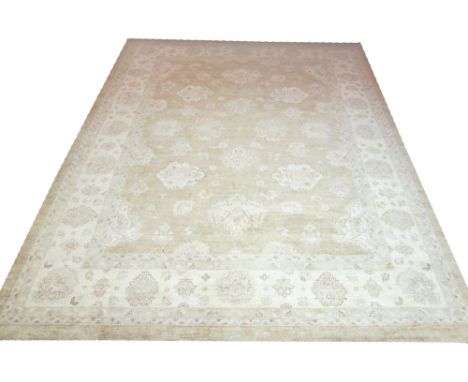 FINE GOLDEN ZIEGLER CARPET, 366cm x 276cm, repeat palmettes and floral sprigs framed by ivory matching palmette and leaf bord