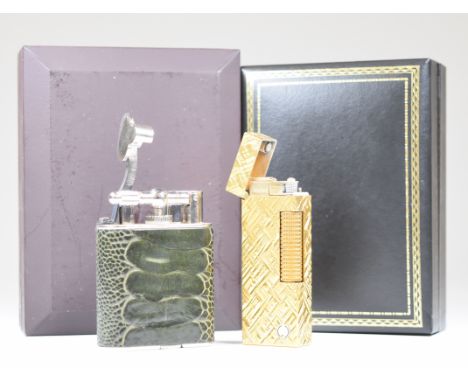 Two Dunhill lighters in original boxes, one a gold plated Rollagas example the other with fish skin or similar covering and m