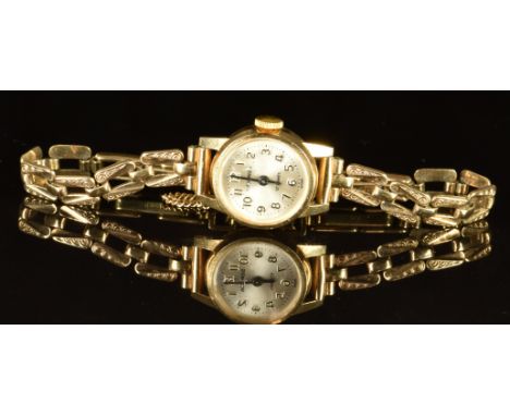 Sekonda 9ct gold ladies wristwatch with black hands and Arabic numerals, silver dial and 17 jewel movement, on 9ct gold brace