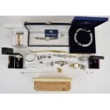 A collection of jewellery including Swarovski necklace, silver bangle, two silver necklaces,
