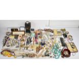 A collection of jewellery including vintage beads, bangles, watches and brooches including Sarah