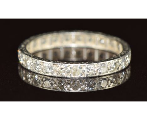 A platinum eternity ring set with 24 round cut diamonds, 2.2g, size L