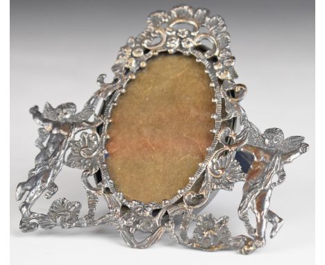 Victorian hallmarked silver oval photograph frame, flanked by winged cherubs, with velvet easel back, marked Wilson &amp; Sha