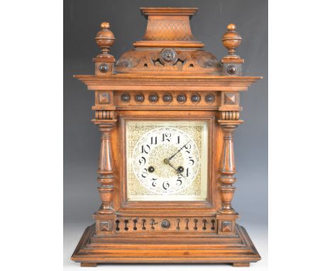 Junghans late 19th or early 20th century mantel clock, the mahogany case having turned columns and roundel decoration, the tw