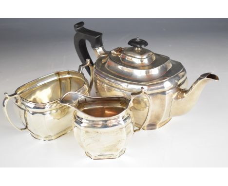 George V hallmarked silver three piece tea set of bulbous rectangular form with incuse corners, Sheffield 1928, maker&nbsp;Ha