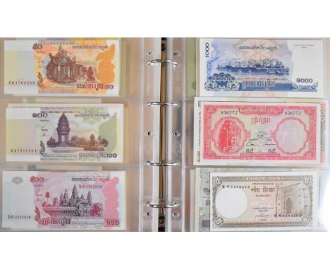 Four Numis albums of all world banknotes, mostly mint / uncirculated but some wartime Japanese notes including $100, countrie