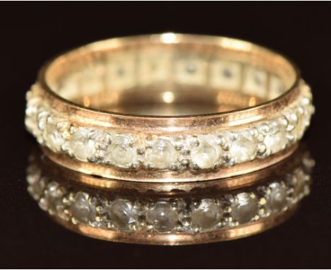 A 9ct gold eternity ring set with quartz, 1.9g, size N/M