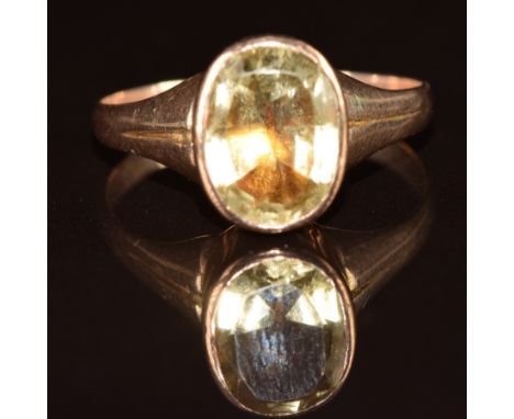 A 9ct rose gold ring set with an oval cut citrine in a foiled setting, 3.7g, size T