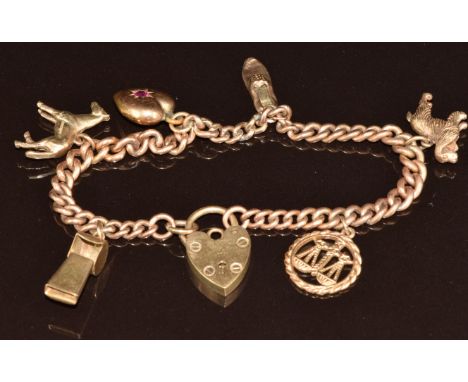 9ct gold charm bracelet with six 9ct gold charms including spaniel, horse, whistle, shoe, heart pendant set with a ruby and l