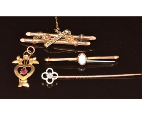 Two 9ct gold brooches, one set with seed pearls and the other an opal, a 9ct gold stick pin set with a spinel and a 9ct gold 