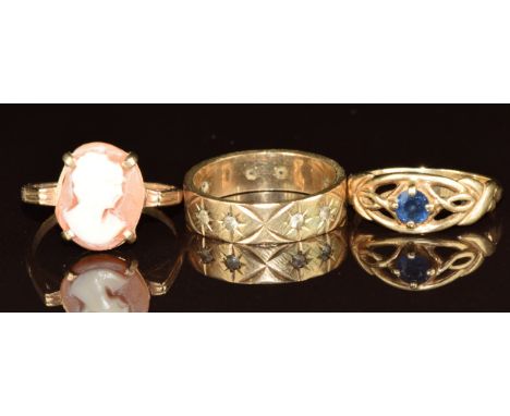 Three 9ct gold rings, one set with a cameo, one a sapphire and the other spinel, 6.7g, size K/L