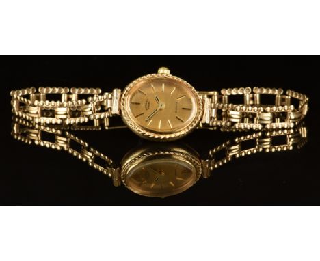 Rotary 9ct gold ladies wristwatch with two-tone hands and baton hour markers, gold dial and quartz movement, on 9ct gold brac