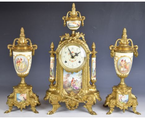 Franz Hermle 19th century style gilt metal and painted porcelain mantel clock garniture, the two train movement striking on a