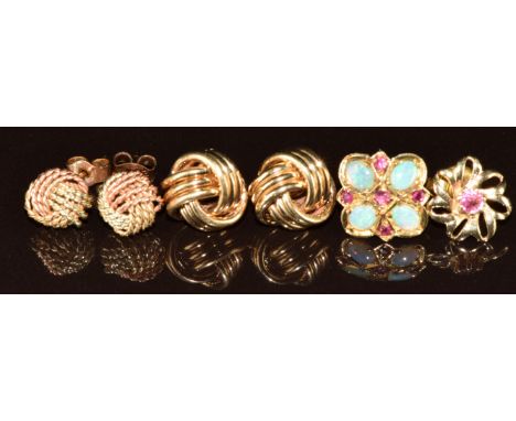 Two pairs of 9ct gold knot earrings (3.3g) and two single earrings one set with a ruby the other opals and rubies (1.8g)
